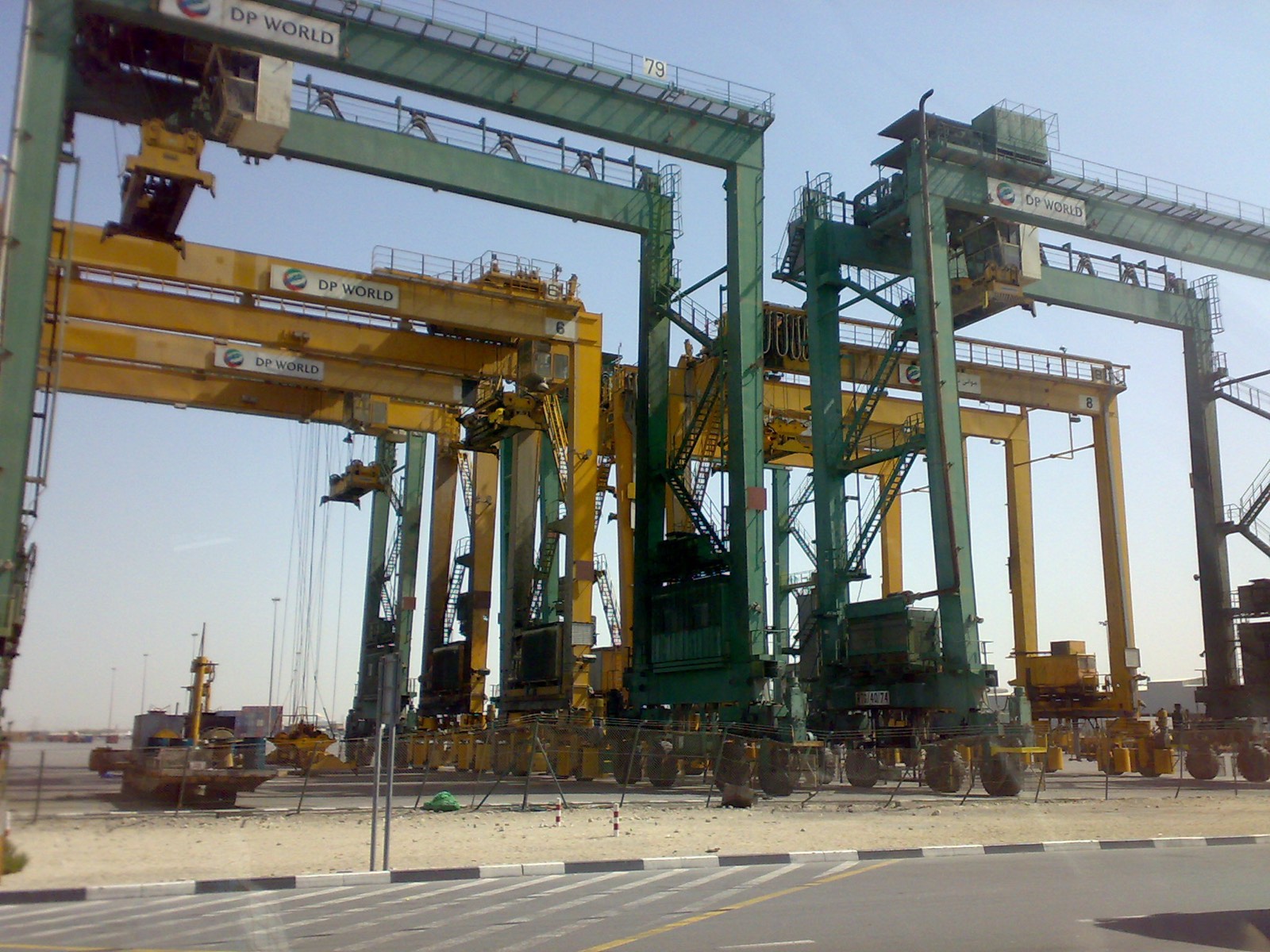 Container ship loading cargo at Jebel Ali Port, Dubai, UAE