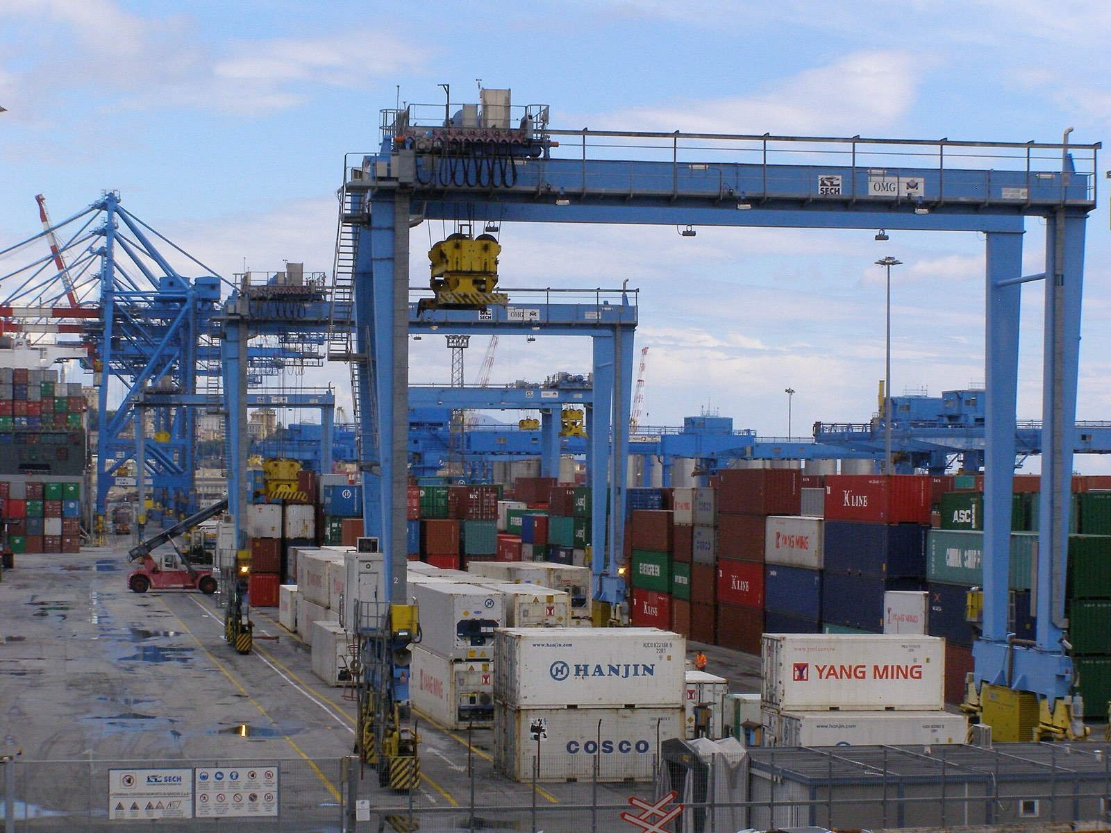 Container cranes at the Port of Genoa handling cargo ships, Italy