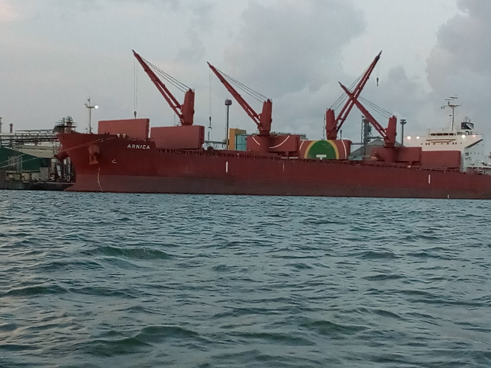 Container ship berthed at Apapa Port, Lagos, Nigeria, with gantry cranes unloading cargo