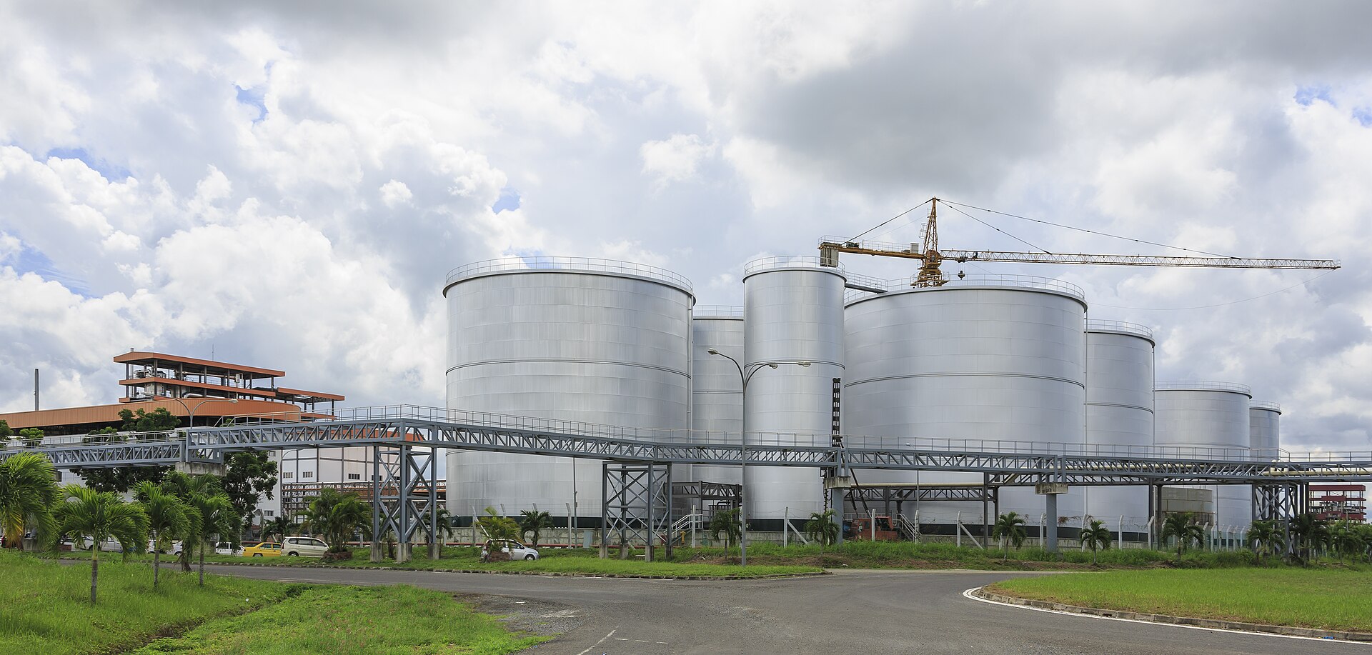 Palm oil storage tanks and loading gantry at an export terminal